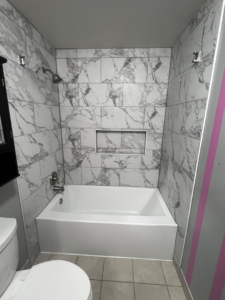 A newly tiled shower and bathtub installation completed by E&D Lozano Handyman in Caldwell, ID.