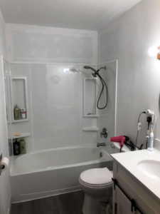 A newly installed tub and shower unit in a renovated bathroom by J & J Cavallo Custom, LLLP in Yakima, WA