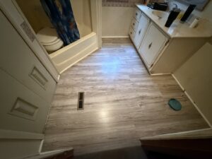 New vinyl plank flooring installed in a bathroom by Max Maintenance in Twin Falls, ID.