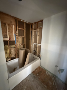 New bathtub installation during a bathroom remodel by Building Better Homes Management, serving homes in Cincinnati, OH.