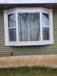 Newly installed bay window on a house exterior by The Best Larry Roofing corp in Mechanicsburg, PA