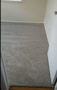 Newly installed gray carpet in a room, a flooring service provided by McCollister Contracting LLC in New Castle, DE.