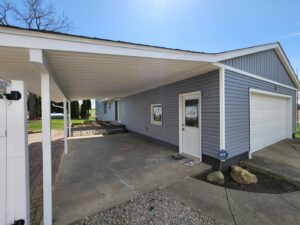 A newly constructed carport and siding installation on a house by The Window Man of Ohio in Westerville, OH.