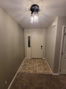 New ceiling light fixture installed in a hallway by Max Maintenance in Twin Falls, ID.