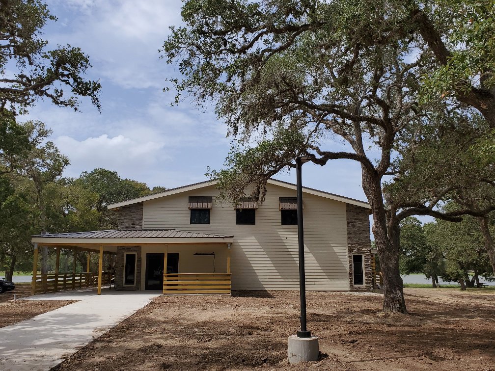 A newly constructed commercial building with a covered porch by Gourley Contractors, LLC, Corpus Christi, TX.