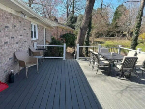 A newly installed composite deck with grey decking and white railings, completed by Bryder Construction in Greenville, SC.