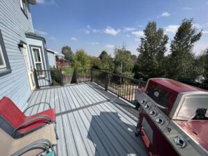A newly installed composite deck with railing, built by High Plains Craftsmen in Cheyenne, WY.