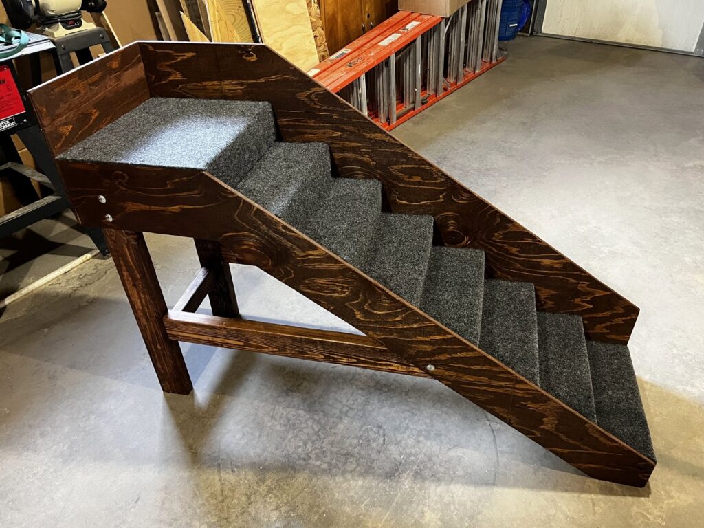 Newly installed composite steps and railing at a home entrance by ROTH WORX LLC in Bismarck, ND.