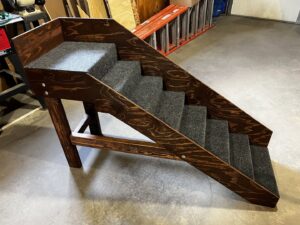 Newly installed composite steps and railing at a home entrance by ROTH WORX LLC in Bismarck, ND.