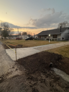 A newly poured concrete culvert and driveway completed by Rolloff Rentals / Rolloff Services in Port Angeles, WA.