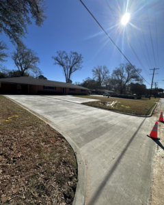 A newly installed concrete driveway by Louisiana Land Solutions in West Monroe, LA.