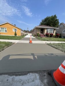 A new concrete driveway in a residential neighborhood, installed by Moons Concrete & Construction LLC in Chicago, IL.
