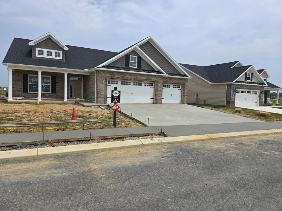 A freshly poured concrete driveway and sidewalk for a new home construction project by J&M Concrete Construction, LLC in Fayetteville, PA.