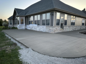 A newly poured concrete patio and driveway installed by R&A Concrete Home Solutions LLC in Appleton, WI.