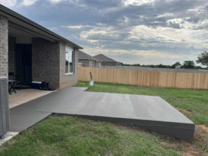 A newly poured concrete patio extension from a house by Power concrete in Thousand Oaks, CA.