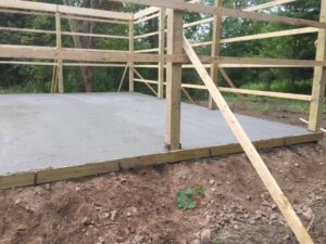 A new concrete slab foundation poured with wooden framing for a structure by Carl Gardner Contracting in Syracuse, NY.