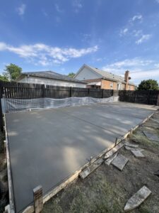 A new concrete slab or patio with wooden forms in place, constructed by Moons Concrete & Construction LLC in Chicago, IL.