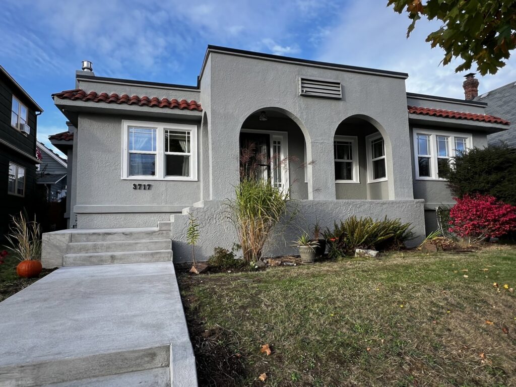 A house with newly installed concrete steps and landscaping by Garages Etc in Tacoma, WA