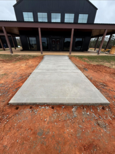 A newly poured concrete walkway installation by S&B Construction Services in Shreveport, LA.