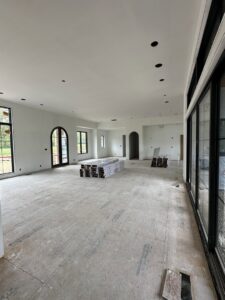 Newly installed drywall completed in a large room during new construction by Hahn Brothers Drywall Co Inc in Evansville, IN