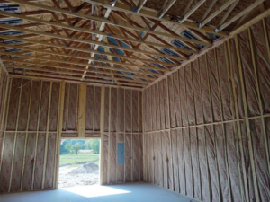 Interior of a new construction building with wood framing and insulation installed by Prairie Insulation LLC in Springfield, IL.