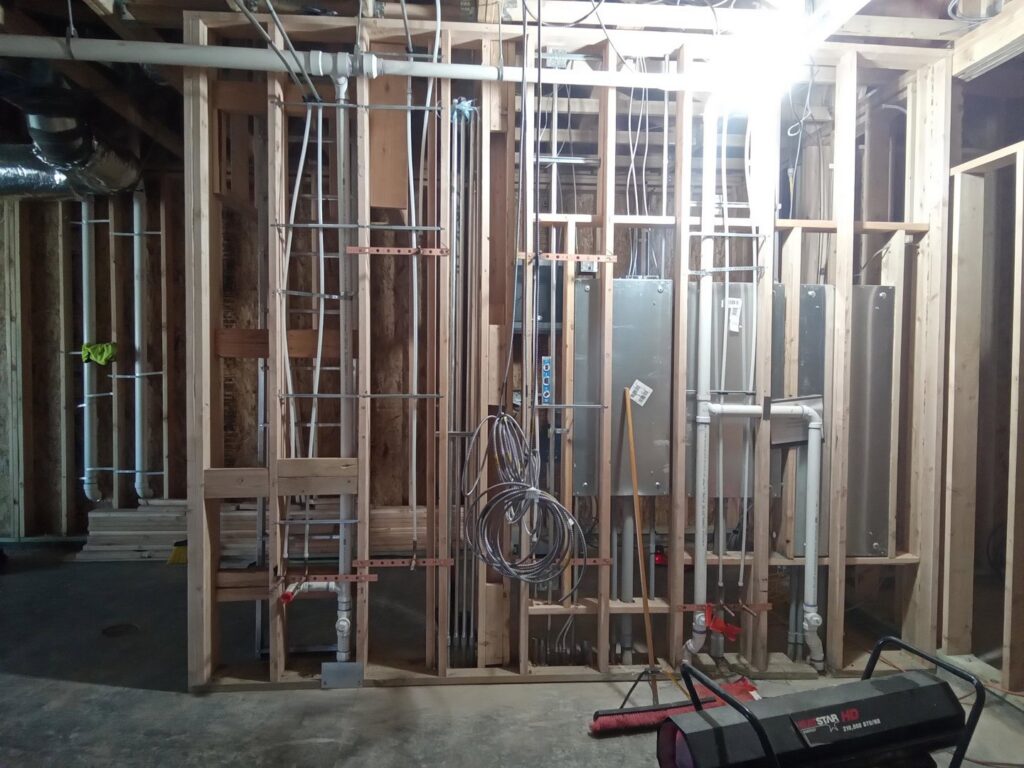 New construction framing with extensive plumbing and electrical rough-in by Top-Notch Plumbing, Heating & Air in Greeley, CO.