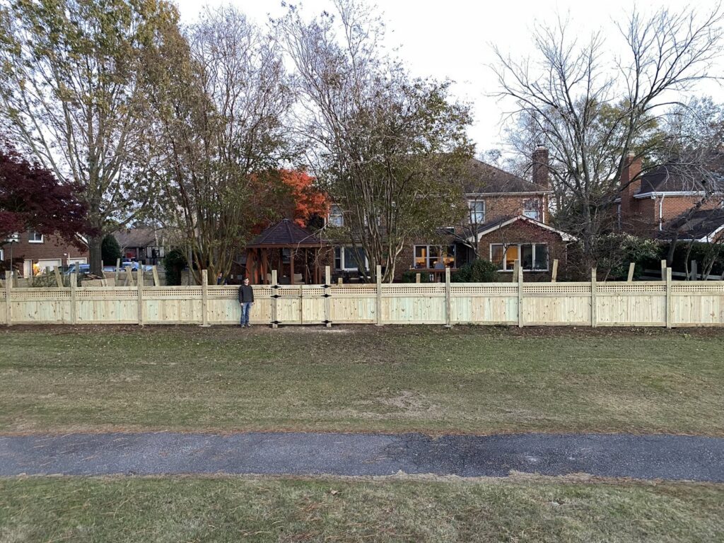 A newly constructed covered porch or deck with a sturdy wooden roof structure, built by Dutch Deck and Fence in Norfolk, VA.