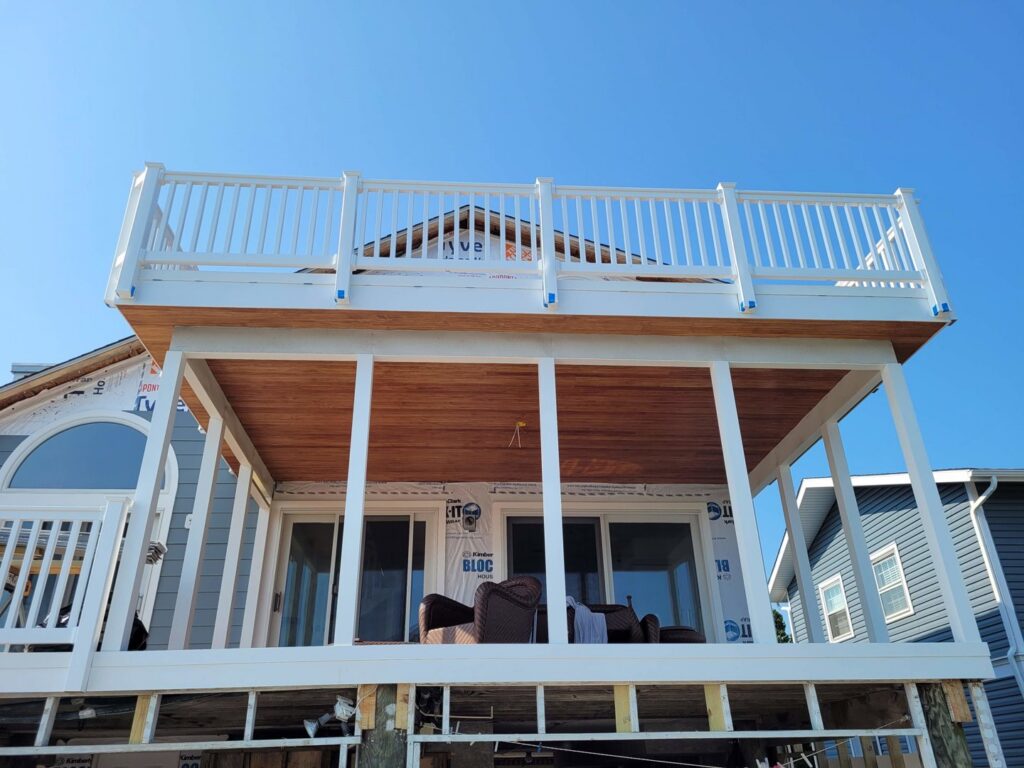 Newly constructed deck and balcony on a house exterior by Priority Property Services in Salisbury, MD.