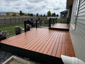 Newly constructed and stained outdoor deck by Midwest Handyman LLC in West Fargo, ND.