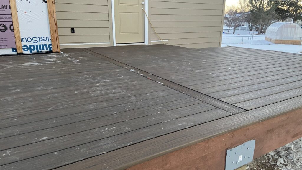 A newly installed composite deck surface, showcasing quality outdoor construction by T&K Services in Idaho Falls, ID