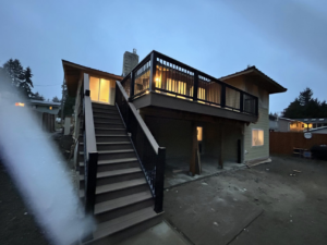 Newly installed deck and stairs on a house by Precision Coatings LLC Siding and Painting Specialist in Tacoma, WA.