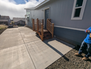 Installation of new deck steps and a concrete pathway by United Property Improvement, a handyman service in Eugene, OR.