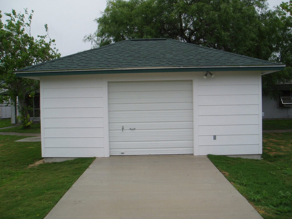 A newly constructed detached garage with a green roof by Gourley Contractors, LLC in Corpus Christi, TX.