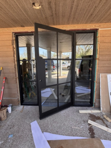 New black metal-framed double door installation by Harwell's Handyman & HVAC Services in Dickson, TN.