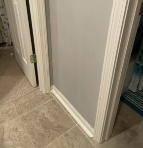 Freshly installed door trim and baseboard in a home by Gateway Home Services KC LLC in Kansas City, MO.