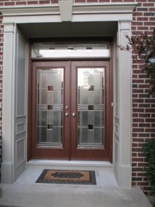 Newly installed double entry doors with decorative glass on a home by Pro Home Solutions in Aiken, SC.