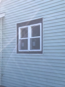 New double-pane window installation on a house exterior by Choice Contractors LLC in Fort Wayne, IN.