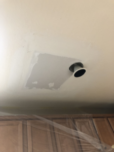 New drywall patch installed on a ceiling with a hole for a recessed light by Fonseca's Drywall, LLC in Glendale, AZ