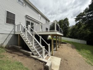 Newly constructed exterior deck with stairs and railings by JAC Home Improvement LLC in Danbury, CT.