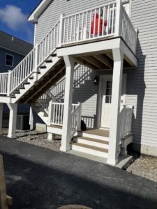 Newly constructed exterior staircase and deck railing on a house by LCM FRAMING LLC in Danbury, CT