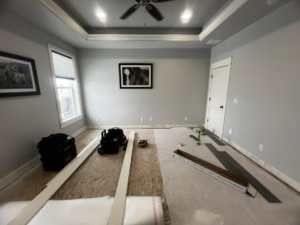 A new floor installation project underway with tools and materials from E&D Lozano Handyman in Caldwell, ID.