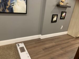 New flooring and baseboard trim installation in a room by J & D Home Innovations in West Jordan, UT