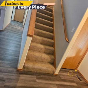 New flooring installed in a hallway next to a carpeted staircase by Dany's contractors LLC in Vancouver, WA.