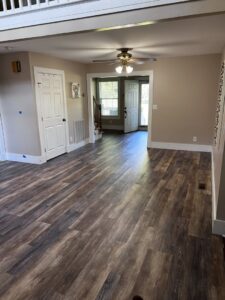 Newly installed flooring and painted walls in a room by Iron Horse Handyman Services LLC in Laramie, WY.