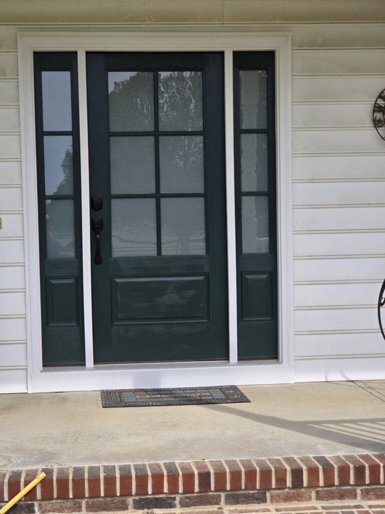 A new front door installation with decorative sidelights by M. Phippin Contracting in Hebron, MD.