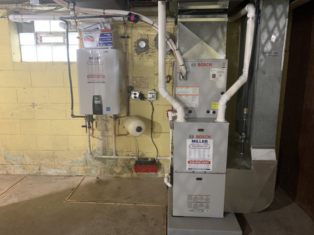 A new furnace and tankless water heater installation by Miller Plumbing Heating Cooling Electric in Pittsburgh, PA.