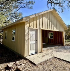 New garage construction with siding and door installed by A. Romero Construction in Roanoke, VA.