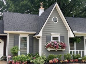 Newly installed gutters and downspouts on a residential home by Elite Roofing Solutions in Bartlett, TN.