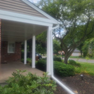 New gutters and siding installation on a house by Jos Construction LLC in Trenton, NJ.