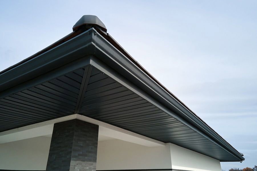 Close-up of newly installed gutters, soffit, and fascia on a roof by Eagle Exteriors in Cumberland, RI.